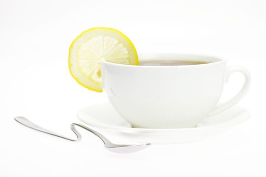 white cup with a lemon isolated on white