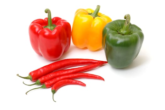Chili pepper and paprika on white background