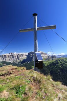 cross with solar panel on Crepa Neigra mount, Italian Dolomites