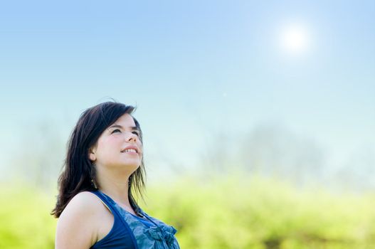 Young happy girl portrait on nature background
