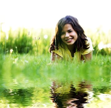 Pretty smiling girl relaxing outdoor