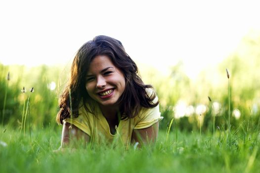 Pretty smiling girl relaxing outdoor