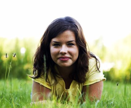 Pretty smiling girl relaxing outdoor