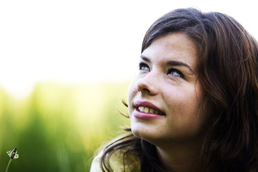 Pretty smiling girl relaxing outdoor