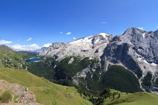summer view of mount Marmolada and Fedaia lake, Trentino, Italy