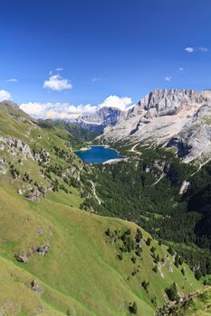 summer view of mount Marmolada and Fedaia lake, Trentino, Italy - Vertical composition