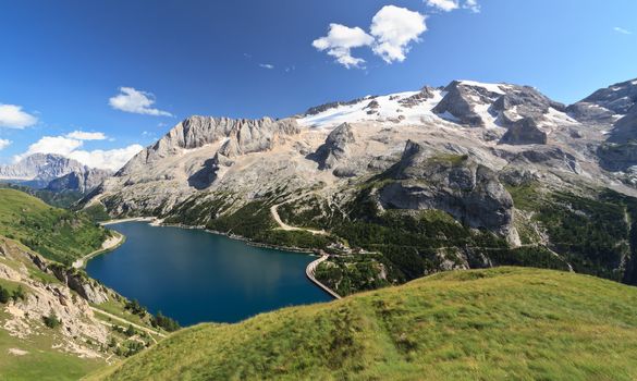 summer view of mount Marmolada and Fedaia lake, Trentino, Italy