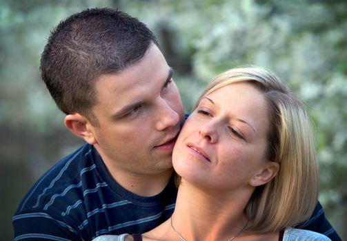 Young couple in love together in romantic scenery