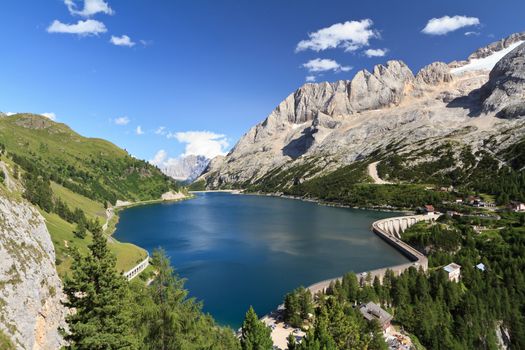 summer view of mount Marmolada and Fedaia lake, Trentino, Italy