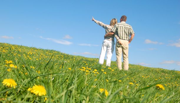 Couple in love on spring meadow