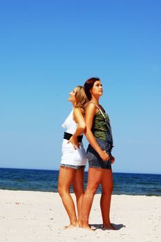 Young attractive girls looking up to the sky