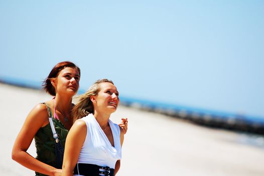 Young attractive girls looking up to the sky