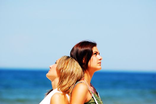 Young attractive girls looking up to the sky