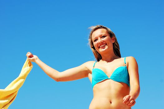 Young attractive woman enjoying summertime on the beach