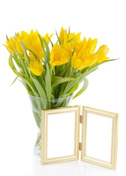 yellow tulips with photo frame on light background