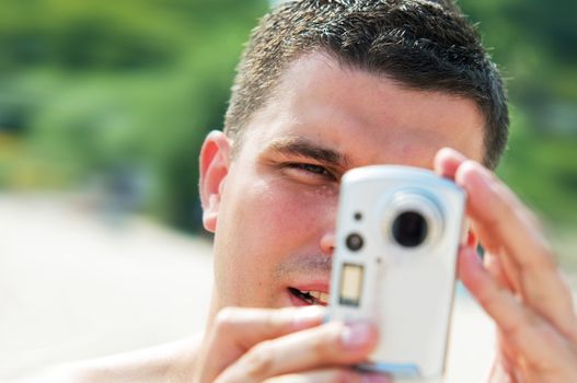 Man taking picture on holidays on the beach