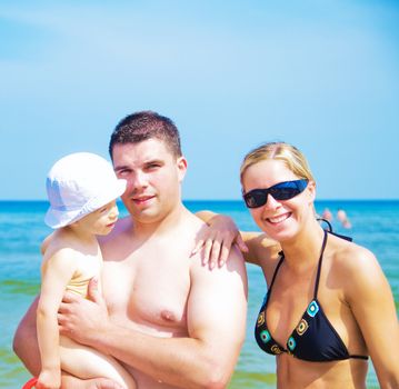 A happy family on the beach portrait