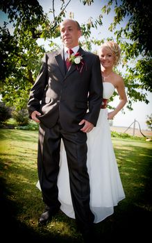 Happy bride and groom happy outdoors after wedding