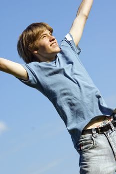 Happy boy jumping with joy