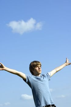 In tune with nature. Young boy showing happiness