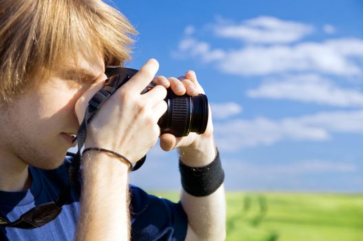 Photographer taking pictures outdoors