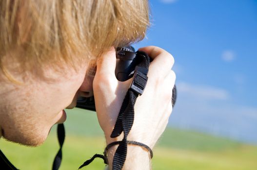 Photographer taking pictures outdoors