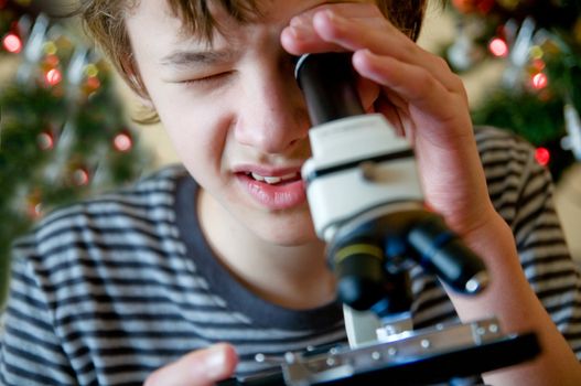 Young boy intrigued by christmas present