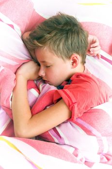 Sleeping boy in bed