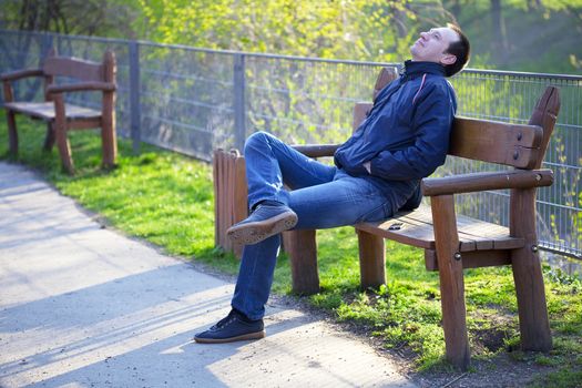 a man sitting on a park bench