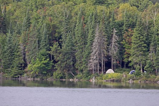 A campsite sitting in on the edge of a lake in Algonquin Provincial Park in Ontario, Canada.
