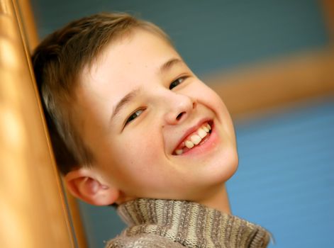 Portrait of young, caucasian boy smiling