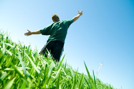 Happy middle-aged man on the summer field