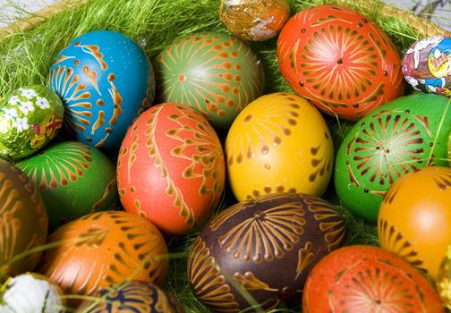 Detail of basket of colored easter eggs Detail of basket of colored easter eggs