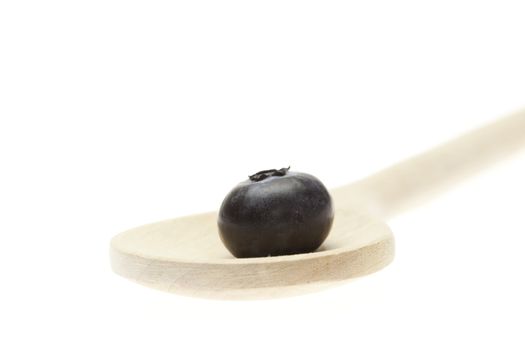 blueberries on the spoon isolated on white