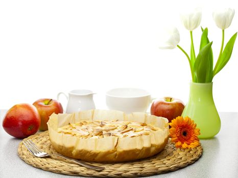 Still life with apple pie, apples and tulips