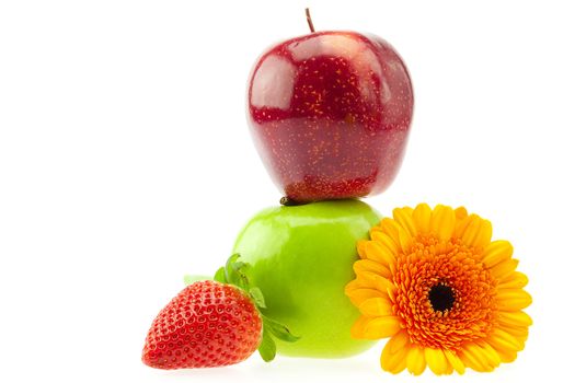 apples, strawberries and a flower isolated on white