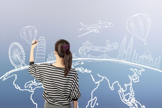 asian woman drawing or writing dream travel around the world