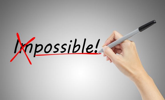 hand drawing and  changing the word impossible to possible, business concept