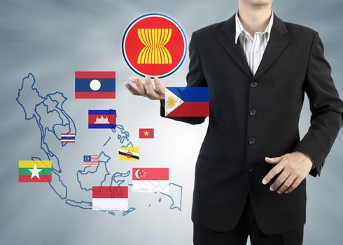 ASEAN Economic Community in businessman hand