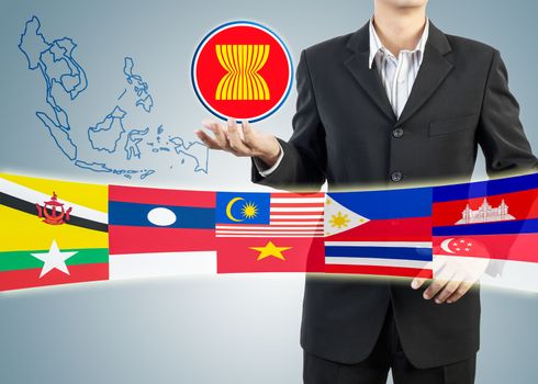 ASEAN Economic Community in businessman hand