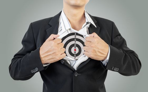 businessman showing target under shirt