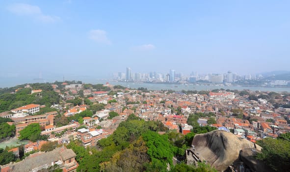 Aerial image of a modern city by a river 