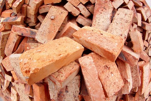 heap of red brick at day 