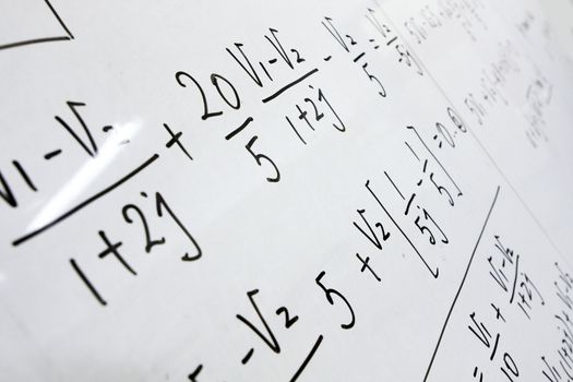 formulas on a whiteboard 