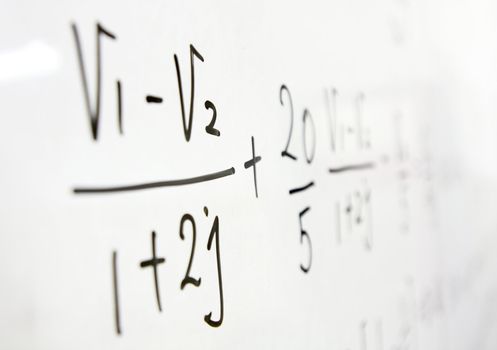 formulas on a whiteboard 