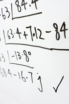 formulas on a whiteboard 