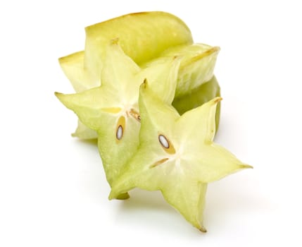 carambola with slices on white background