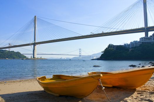 boat on the beach under the bridge