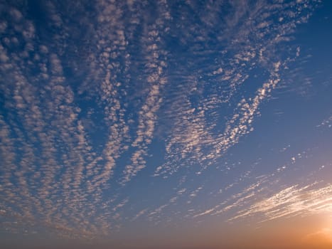 Perfect soft Cumulus clouds formation in sunset nature background