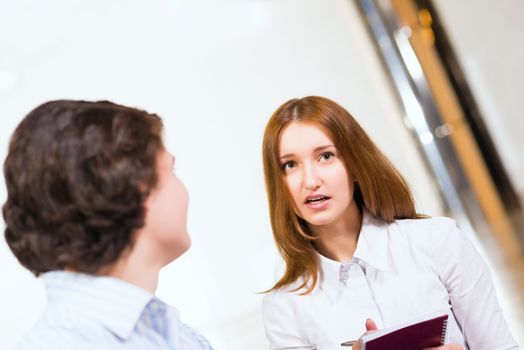 Attractive woman talking with a man, close up portrait